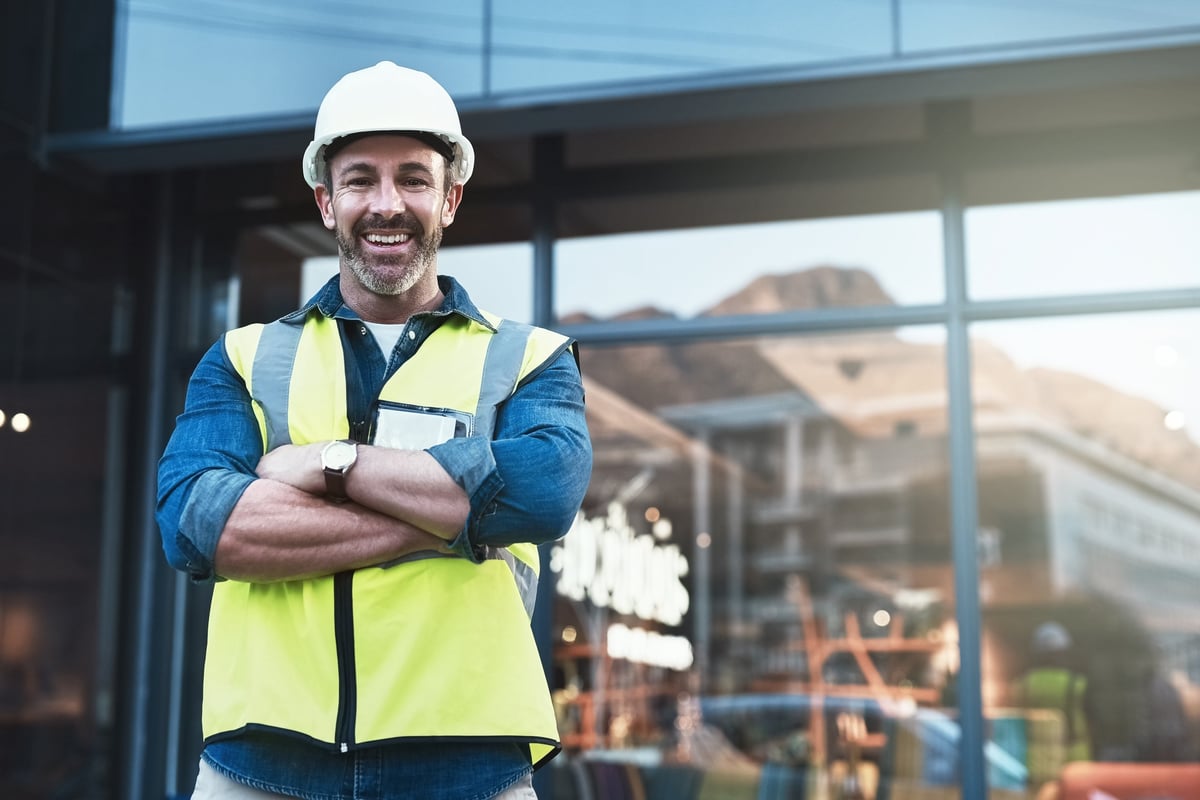 Shot of a engineer standing in front of a building